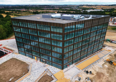 Striking drone photo of a new building in Leeds with overcast sky.