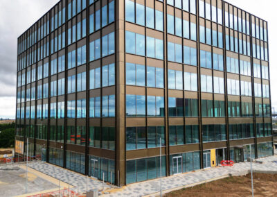 Striking drone photo of a new building in Leeds with overcast sky.