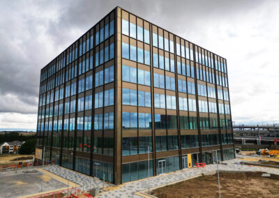 Striking drone photo of a new building in Leeds with overcast sky.